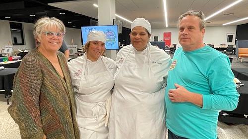 Winners pose with owners of Grumpy's restaurant